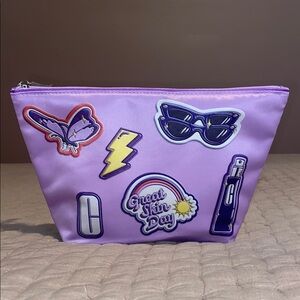 Clinique Lavender Cosmetic Bag with 7 travel size items inside brand new!